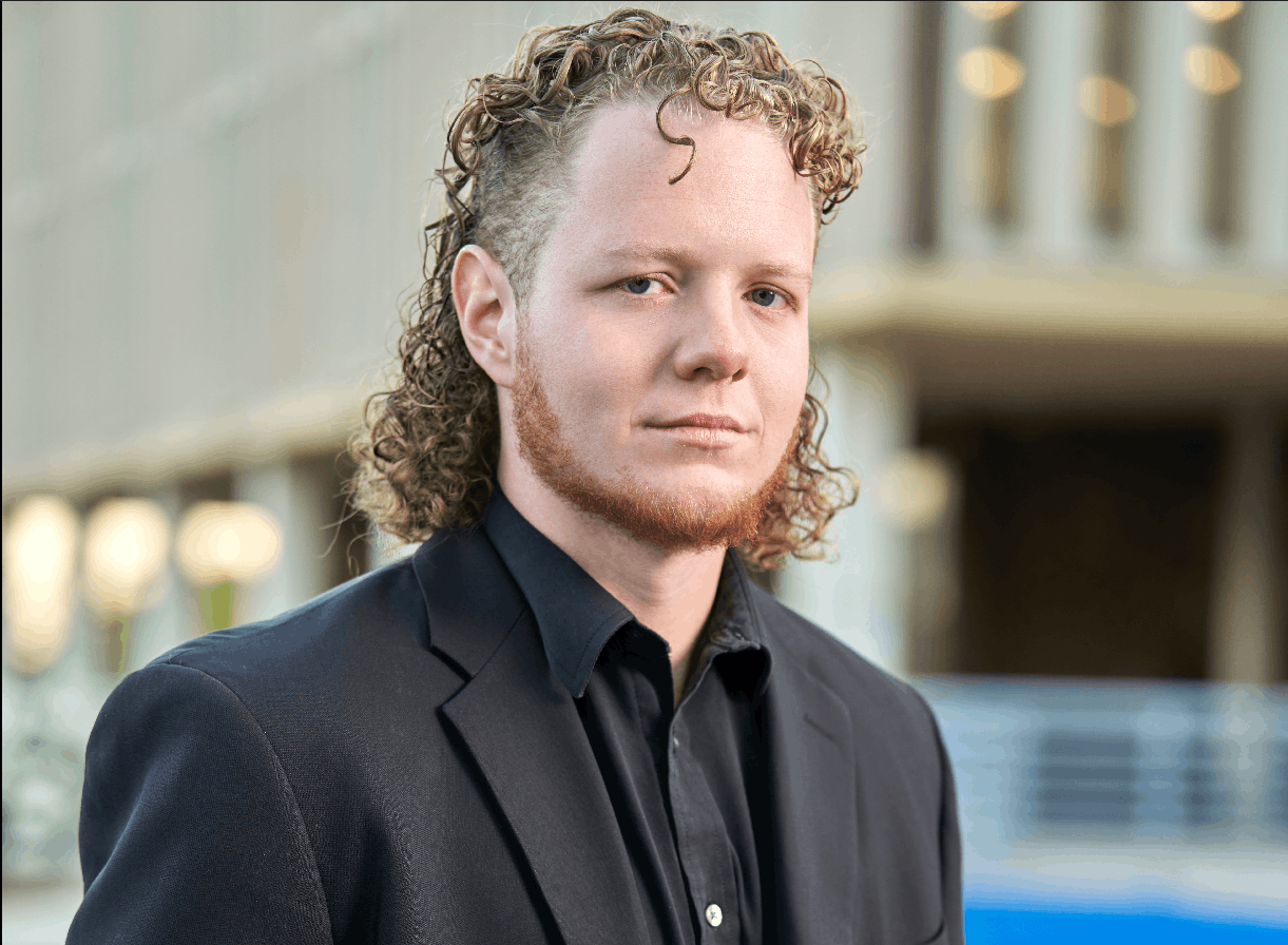 Oliver Seth-Smith wearing a dark suit
